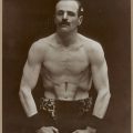Strongman John A Rice displaying muscle definition H93.406/12